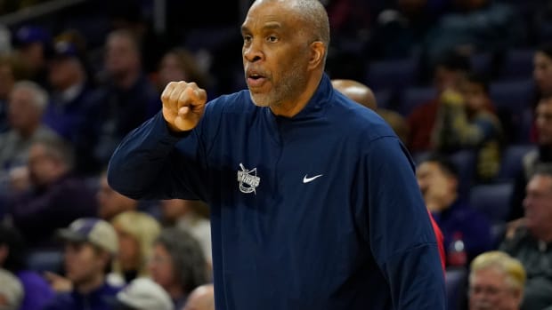 Detroit Mercy Titans head coach Mike Davis gestures to his team during the first half at Welsh-Ryan Arena.